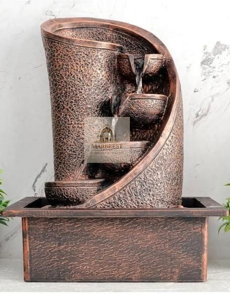 Artisan Zen: Hand-Carved Multi-Tier Stone Fountains — marble installation by Marbrest Stone, Boutique Resort / Private Garden